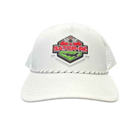 White protective gear with a logo on a dark surface
