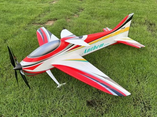 Model airplane with 'Anthem' branding on a grassy field