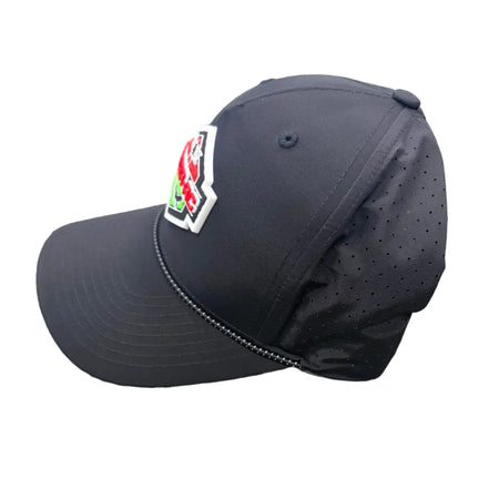 Black baseball cap with a logo on a textured surface