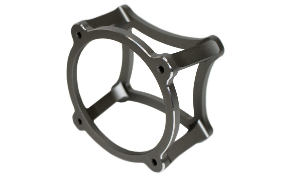 Metallic gray cage-like object on a white background