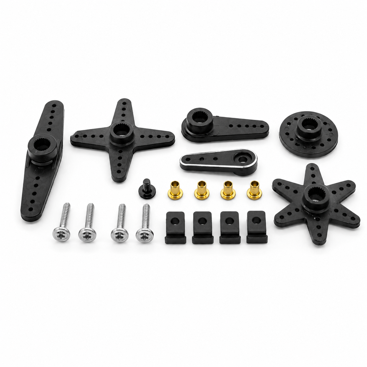 Set of black mechanical parts and screws on a white background