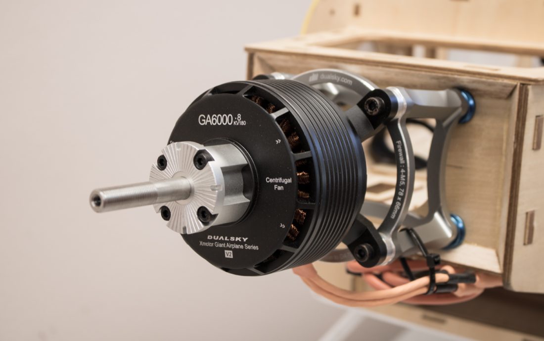 Close-up of a dualsky GA6000 brushless motor on a wooden frame.