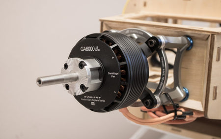 Close-up of a dualsky GA6000 brushless motor on a wooden frame.